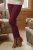 Close-up shot of cyclamen knitted leggings from the waist down